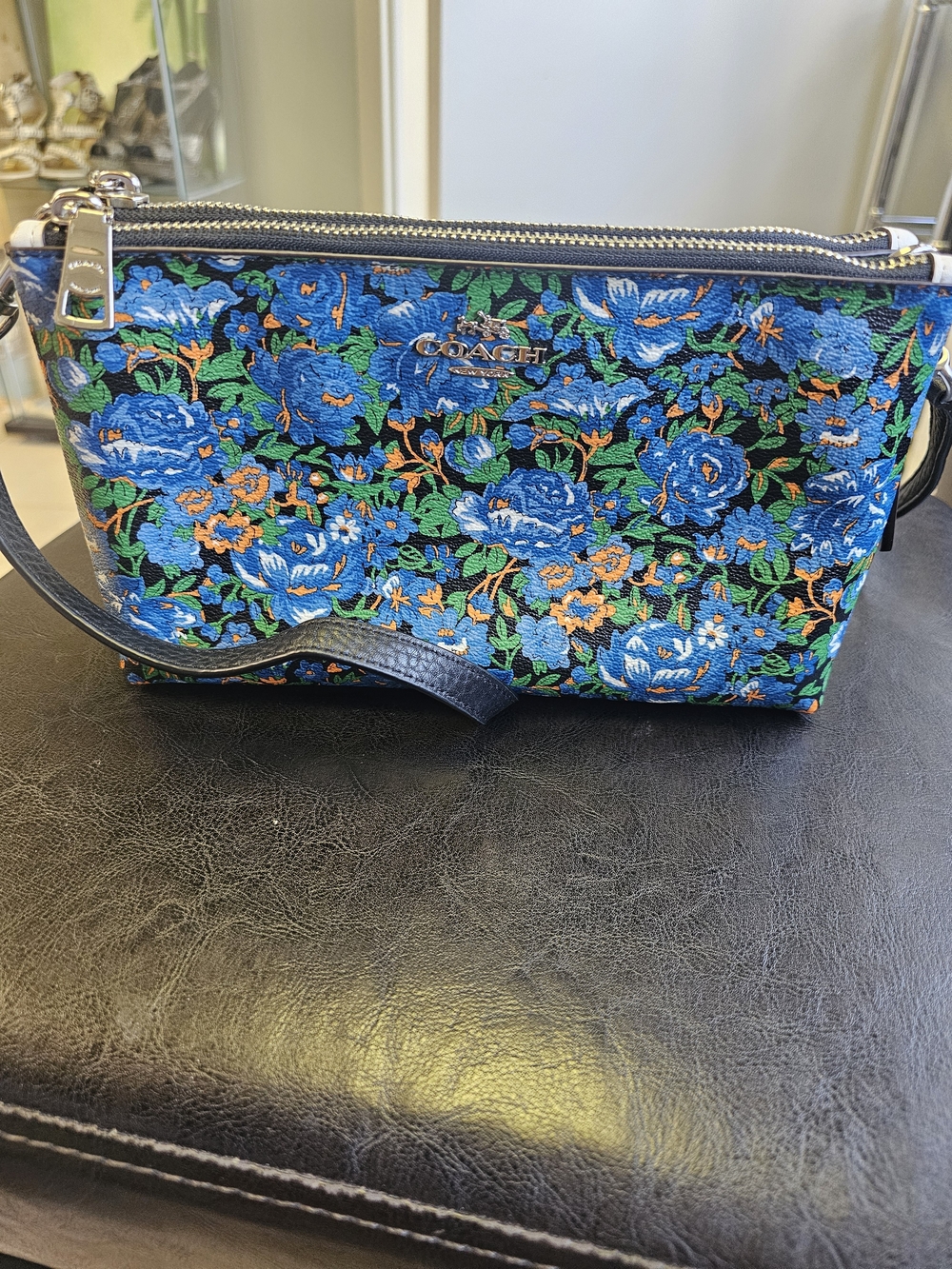 Coach Blue Floral Wristlet with Green and Orange Accents